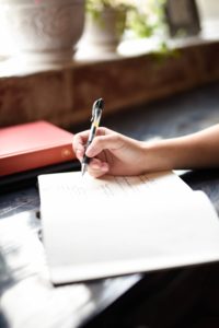 A woman writing in a journal